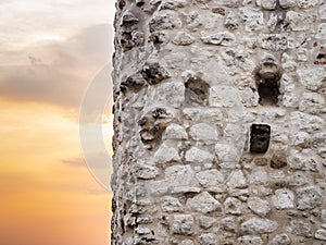 Facade of Drachenfels castle ruins with sunset