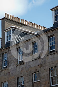 Facade of Edinburgh Town House showing rows of chimney pots