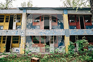 Facade exterior of old ruined abandoned building of Soviet Pioneer camp