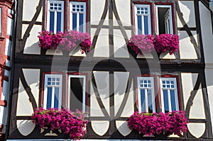 Facade of Fachwerkhaus with flowers in Germany