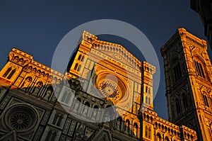 The Facade of Florence Cathedral in golden light photo