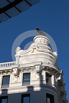 Facade of the former Hotel Rome with the iconic bronze sculpture of the Capitoline Wolf at the rooftop