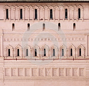 The facade of the fortress wall. Windows, stucco of an old building