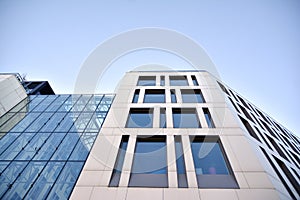 Facade fragment of a modern office building. Exterior of glass wall with abstract texture.