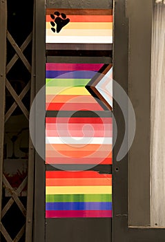 Facade of gay friendly pub adorned with pride flags in Benidorm