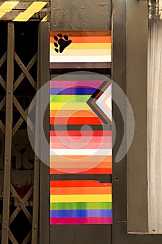 Facade of gay friendly pub adorned with pride flags in Benidorm