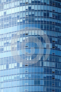 Facade of a glass building as a background. Vertically