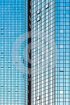 Facade glass front of skyscraper with sun reflections