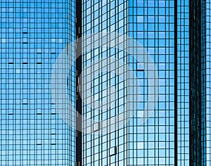 Facade glass front of skyscraper with sun reflections