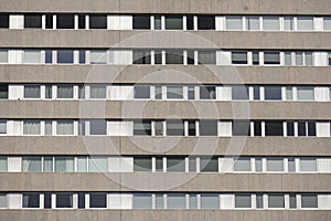 facade with granite cladding and a multitude of similar windows