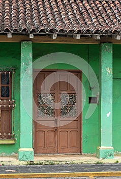 Facade of a green traditional house. Tlacotalpan, Veracruz, Mexico