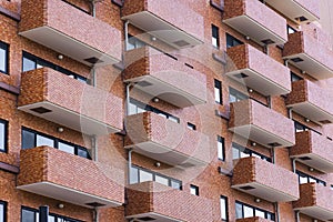 facade of a high rise residential building, with balconies, in Tokyo