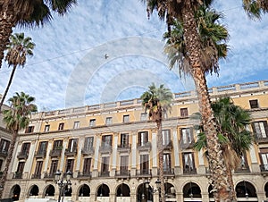 facade of a historic building in Barcelona in Catalonia, Spain. Cityscape with palm