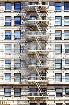 Facade of historic skyscraper downtown Los Angeles with fire esc