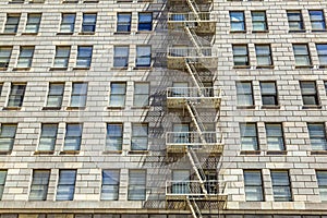 Facade of historic skyscraper downtown Los Angeles with fire esc