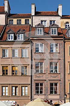 Facade of historical buildings in Old town market square in Warsaw, Poland