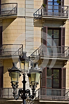 Facade of a house in Barcelona and a street lamp