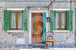 Facade of a house with a curtain in Burano, Italy