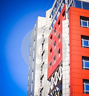 Facade of the house red in the high-tech style