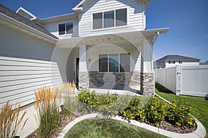 Facade of a house with traditional design and front yard garden at Utah