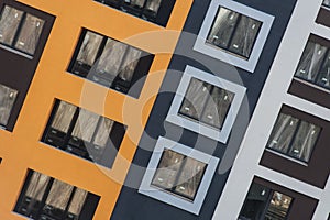 Facade of the house under construction with multi-colored decorative plaster