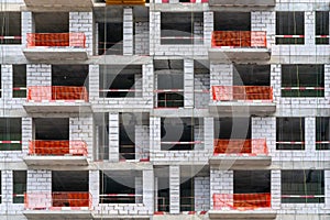 Facade of a house under construction. Ðœodern building industry.