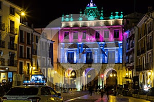 Facade illuminated with bright colored lights. Cuenca. Spain