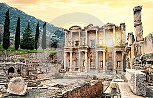 Facade of a Library of Celsus in Ephesus under yellow sky