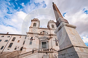 Facade of the main entrance to the Holy Trinity Church of the Mountains and its obelisk in Rome in Lazio, Italy