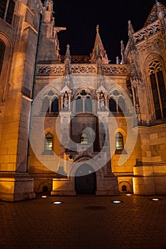 Facade of Matthias Church at night with ligtht on Budapest Holy Trinity Square photo