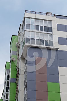 The facade of a modern building in which people live in apartments in the city center. modern new construction