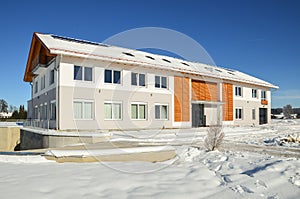 Facade of a modern commercial building shortly after its completion in winter