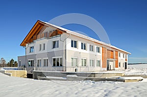 Facade of a modern commercial building shortly after its completion in winter