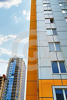 Facade of a modern multi-storey residential complex, apartment building exterior