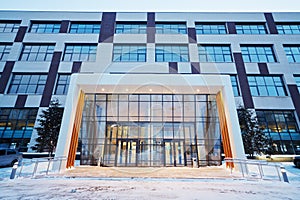 Facade of modern office building in evening