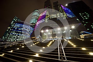 Facade of modern office building at night photo