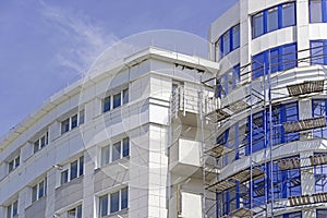 The facade of modern residential building under construction