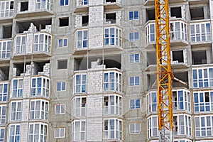 The facade of modern residential building under construction