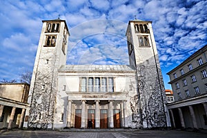 The facade of a modernist church with two bell towers in Poznan