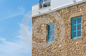 Facade of natural stones on a Mediterranean house