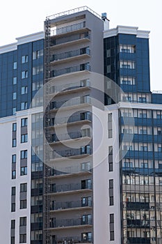 Facade of a new multi-storey residential building. architecture of the modern city