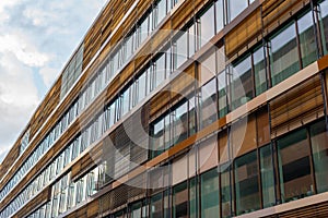 Facade of an office building with wooden sun shades