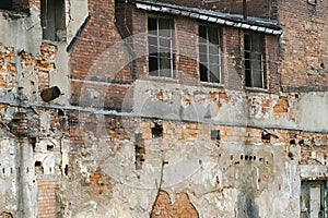 Facade of the old abandoned factory, close up
