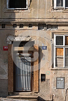 The facade of the old abandoned house. Windows and the input arrays photo