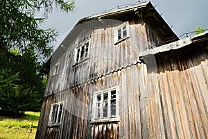 Facade of an old abandoned scary wooden house.