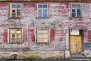 Facade of an old abandoned wooden house