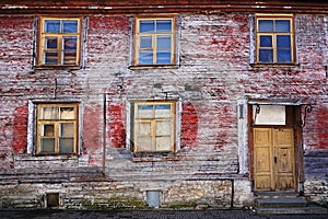 Facade of an old abandoned wooden house