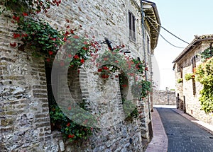 Facade of an old building in the historic center of Assisi, Umbria, Italy