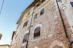 Facade of an old building in the historic center of Assisi, Umbria, Italy