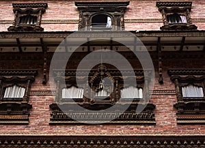 Facade of an old building in Kathmandu decorated with Newari wood carving